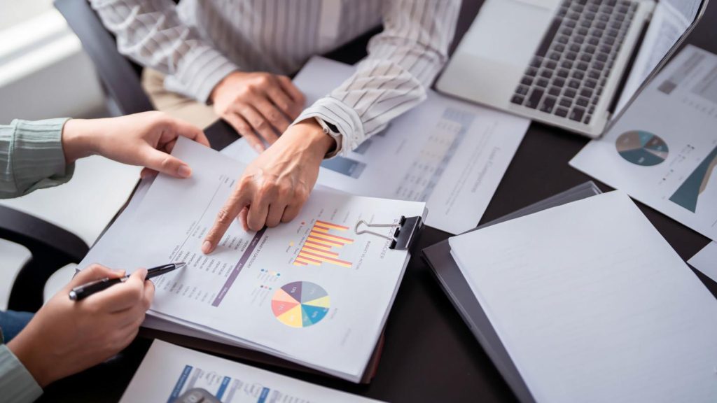 Investor reviewing commercial property due diligence documents in Texarkana